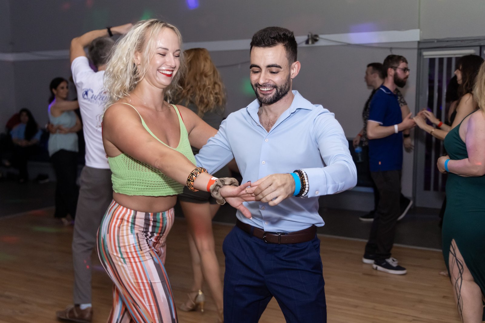 Beginners learning the salsa basic step